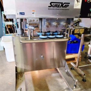 SURE KAP MODEL SK 600 IN-LINE CAP TIGHTENER/RETORQUER 6 SPINDLE W/THREE SETS OF SPINDLES